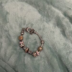 Elegant Silver and Gold Charm Bracelet